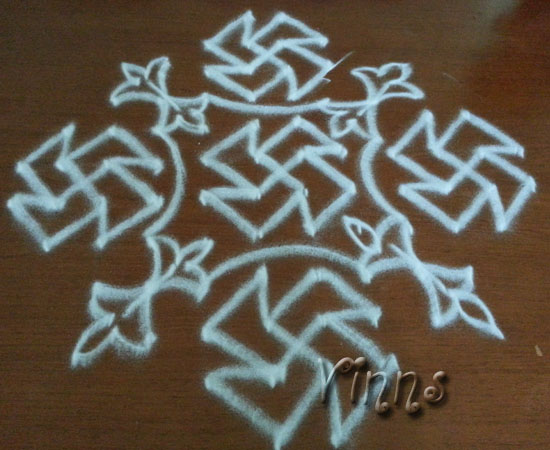 Swastik kolam with 12 dots