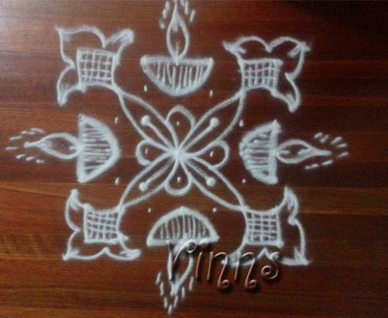 5 Pulli kolam with vilakku design
